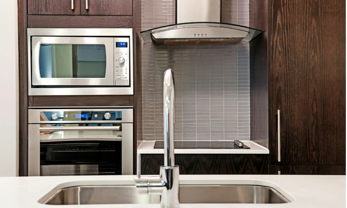 A Microwave Above A Wall Oven